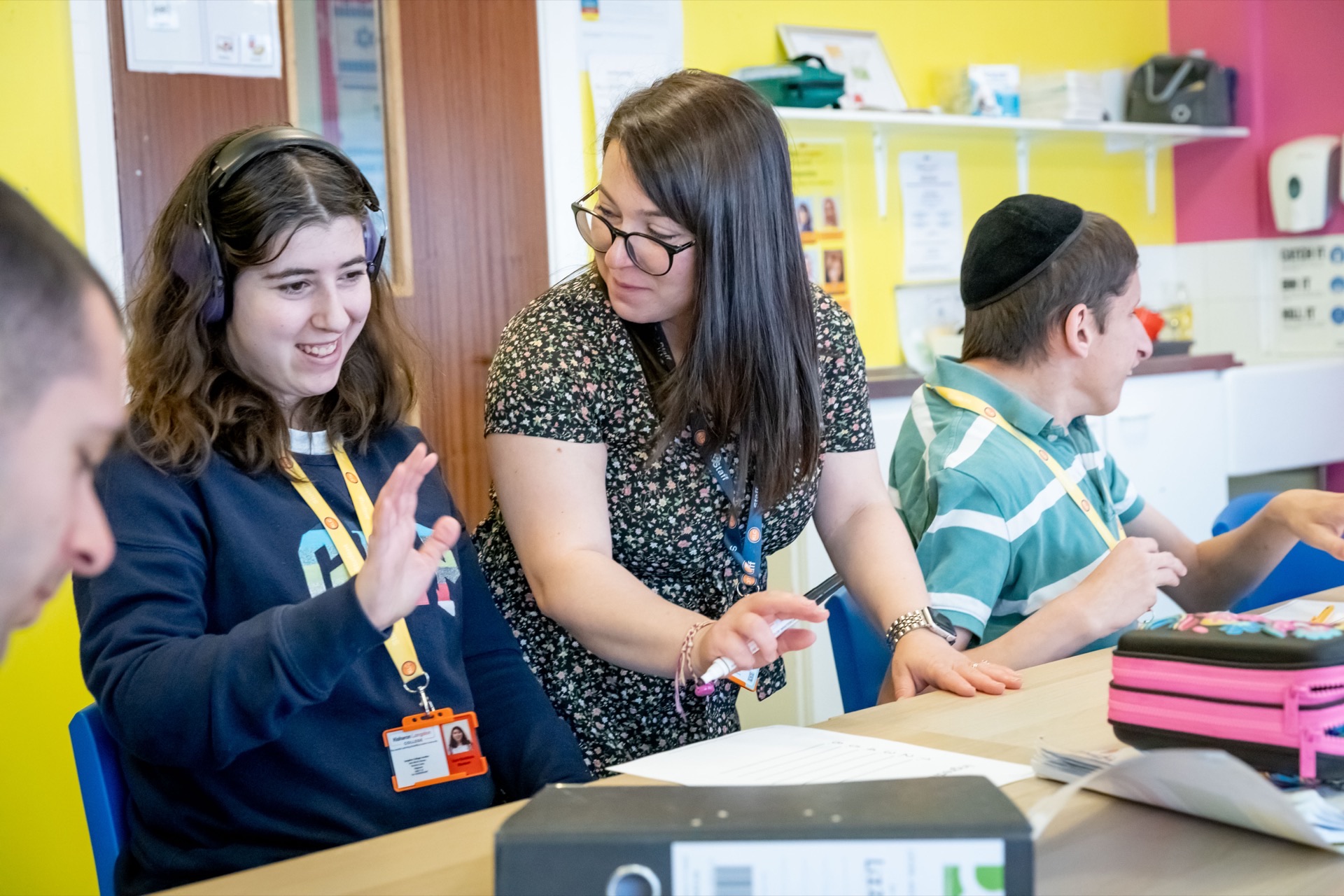 A teacher supporting a student at Kisharon Langdon