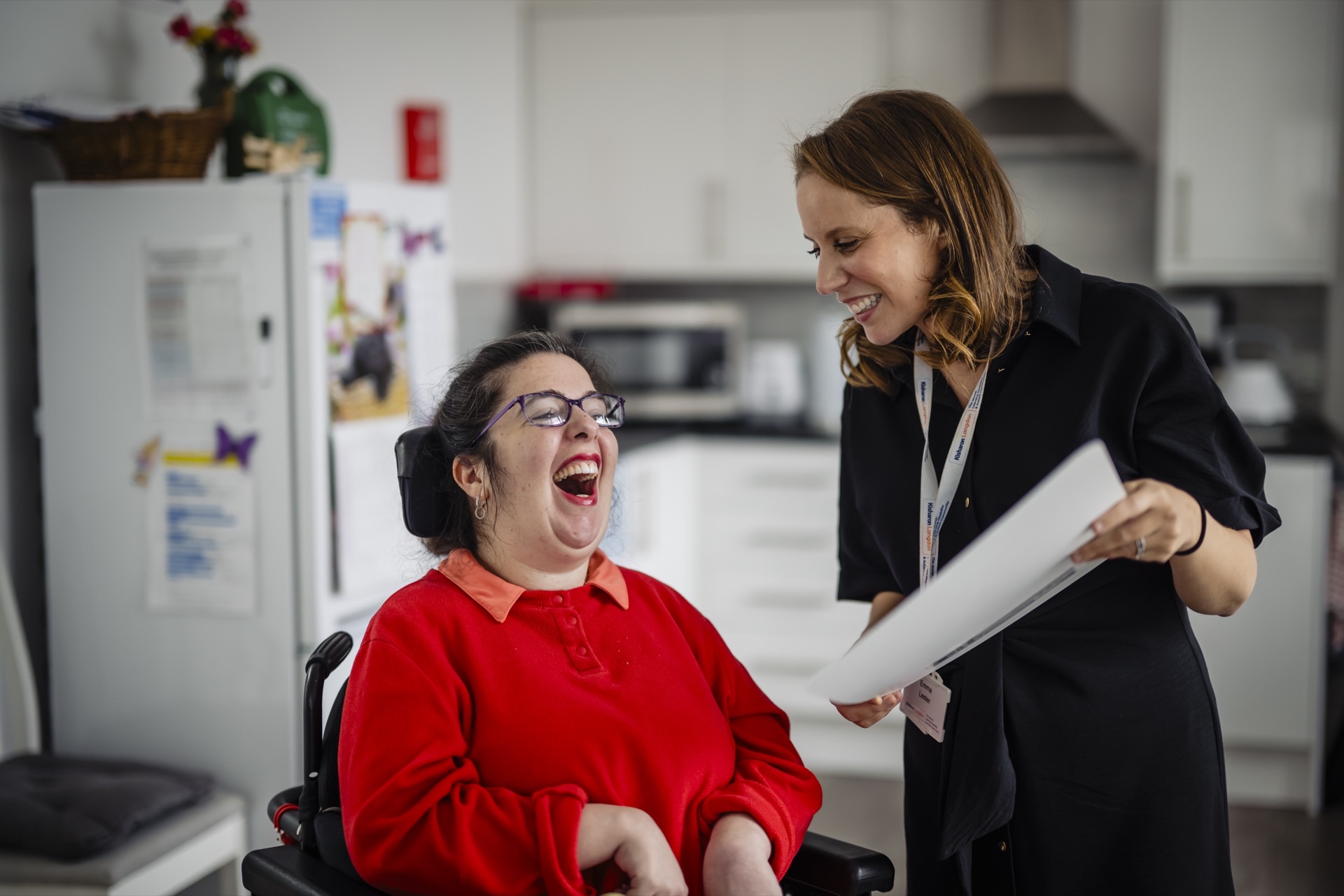 A teacher supporting a student at Kisharon Langdon