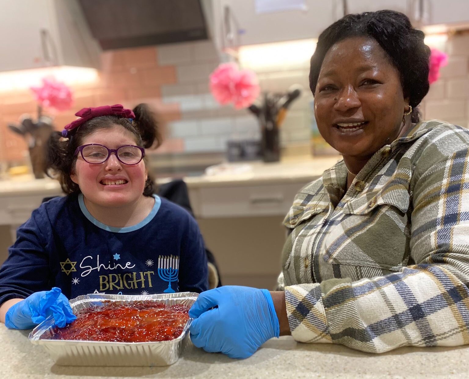 Volunteers working with members at Kisharon Langdon
